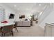 Basement living room featuring carpeting, modern decor, and a comfortable seating area at 2840 S Bannock St, Englewood, CO 80110