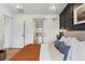 Main bedroom showing barn door leading to ensuite bathroom and hallway at 2840 S Bannock St, Englewood, CO 80110