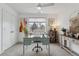 Bright home office featuring a vintage desk, modern decor, large window with natural light at 2840 S Bannock St, Englewood, CO 80110