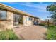 Lovely brick patio with sliding glass door access to the house and view of the spacious backyard at 772 Urban Ct, Lakewood, CO 80401