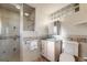 Bathroom with walk-in shower and blue accent tiles at 772 Urban Ct, Lakewood, CO 80401