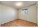 Cozy bedroom with hardwood floors, a window, and a closet at 772 Urban Ct, Lakewood, CO 80401