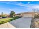 Well-maintained single-story home with a spacious driveway and attached two-car garage at 772 Urban Ct, Lakewood, CO 80401