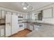 Bright kitchen features updated cabinets, countertops, appliances, and a window view at 772 Urban Ct, Lakewood, CO 80401