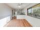 Dining Area featuring wood floors, open kitchen and large window to bring in the natural light at 772 Urban Ct, Lakewood, CO 80401