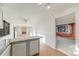 Bright living room featuring hardwood floors, brick fireplace, and abundant natural light, creating a warm atmosphere at 772 Urban Ct, Lakewood, CO 80401