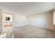 Bright living room with neutral carpeting and an open layout, perfect for entertaining or relaxation at 772 Urban Ct, Lakewood, CO 80401
