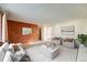 Spacious living room featuring modern decor, neutral tones, and a cozy seating arrangement at 772 Urban Ct, Lakewood, CO 80401