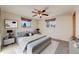 Calm bedroom featuring neutral colors, two large windows, and a plush bed for a serene retreat at 772 Urban Ct, Lakewood, CO 80401