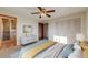 Bright bedroom with a ceiling fan, closet, and en-suite bathroom at 772 Urban Ct, Lakewood, CO 80401