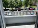 View from the balcony of the neighborhood with cars and trees at 5255 Memphis St # 712, Denver, CO 80239