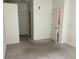 Unfurnished bedroom with carpet and access to two separate closets for storage at 5255 Memphis St # 712, Denver, CO 80239
