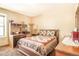 Cozy bedroom with a queen-size bed and dresser at 1557 S Owens St # 59, Denver, CO 80232