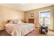 Spacious bedroom with a large bed and window at 1557 S Owens St # 59, Denver, CO 80232