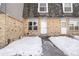 Brick townhouse exterior with snow-covered walkway at 1557 S Owens St # 59, Denver, CO 80232