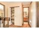 Hallway with linen closet and bathroom access at 1557 S Owens St # 59, Denver, CO 80232