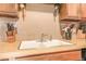 Kitchen sink with double basin and wall-mounted faucet at 1557 S Owens St # 59, Denver, CO 80232