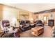 Living room with leather furniture and wood coffee table at 1557 S Owens St # 59, Denver, CO 80232