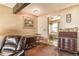 Living room with exposed beam, leather furniture, and wood table at 1557 S Owens St # 59, Denver, CO 80232