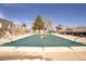 Community swimming pool with a safety cover, ideal for relaxation and recreation at 1557 S Owens St # 59, Denver, CO 80232