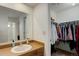 Bathroom with sink, mirror, and closet at 12430 E Pacific Cir # B, Aurora, CO 80014