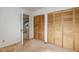 Bedroom with closet, neutral carpet and entry to the lofted office at 12430 E Pacific Cir # B, Aurora, CO 80014