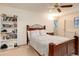 Bedroom with wood furniture and large bookcase at 12430 E Pacific Cir # B, Aurora, CO 80014