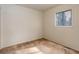 Neutral bedroom with light carpet and a large window with blinds at 12430 E Pacific Cir # B, Aurora, CO 80014