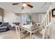 Open dining area with modern furniture, light wood floors, and an airy atmosphere close to the staircase and living area at 12430 E Pacific Cir # B, Aurora, CO 80014