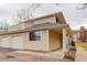 Charming two-story home featuring neutral siding, a covered entryway, an attached garage, and low-maintenance landscaping at 12430 E Pacific Cir # B, Aurora, CO 80014