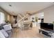 Open-concept living area with a dining space, view of staircase, and seamless access to the kitchen and modern appliances at 12430 E Pacific Cir # B, Aurora, CO 80014
