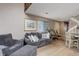 Bright living room featuring a comfortable couch, modern furniture, and ample natural light, creating a welcoming space at 12430 E Pacific Cir # B, Aurora, CO 80014