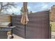 Side yard patio with privacy screen and natural gas grill at 12430 E Pacific Cir # B, Aurora, CO 80014