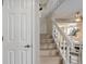 Staircase with white railings leading to the second floor at 12430 E Pacific Cir # B, Aurora, CO 80014