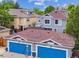 Aerial view of garages, homes, patios, and mountain views in the background at 1160 S Sherman St, Denver, CO 80210