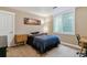Cozy bedroom with a queen bed, a window for natural light, and neutral decor at 1160 S Sherman St, Denver, CO 80210
