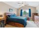 Comfortable bedroom with vaulted ceilings, a large bed, and a window with blue curtains at 1160 S Sherman St, Denver, CO 80210