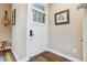 Entryway features a white door with glass panel, hardwood floors, and stylish decor at 1160 S Sherman St, Denver, CO 80210