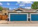 Blue garage door with trim and house number 1160 at 1160 S Sherman St, Denver, CO 80210