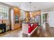 Spacious kitchen with hardwood floors, stainless steel appliances, a central island, and ample cabinet space at 1160 S Sherman St, Denver, CO 80210