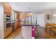 Open kitchen features hardwood floors, stainless steel appliances, granite countertops, and a center island at 1160 S Sherman St, Denver, CO 80210