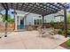 Relaxing patio with pergola, outdoor seating, grill, landscaping, hammock, and blue door at 1160 S Sherman St, Denver, CO 80210