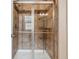 Tiled shower with a glass door, providing a spa-like experience in this modern bathroom at 1160 S Sherman St, Denver, CO 80210