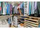 Organized walk-in closet with shelving, hanging rods, and storage drawers for efficient wardrobe management at 1160 S Sherman St, Denver, CO 80210