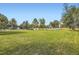Expansive backyard with lush lawn and mature trees providing privacy at 2101 Champlain Dr, Boulder, CO 80301