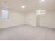 Unfinished basement with carpet and egress windows at 2101 Champlain Dr, Boulder, CO 80301