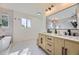 This bathroom features double sink vanity, new fixtures and bright window at 2101 Champlain Dr, Boulder, CO 80301