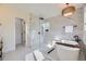 Bright bathroom featuring new tile, walk-in shower, and soaking tub at 2101 Champlain Dr, Boulder, CO 80301