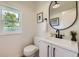 Modern bathroom features updated vanity, fixtures and bright window at 2101 Champlain Dr, Boulder, CO 80301