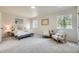 Light filled bedroom with plush carpet, white trim and neutral walls at 2101 Champlain Dr, Boulder, CO 80301